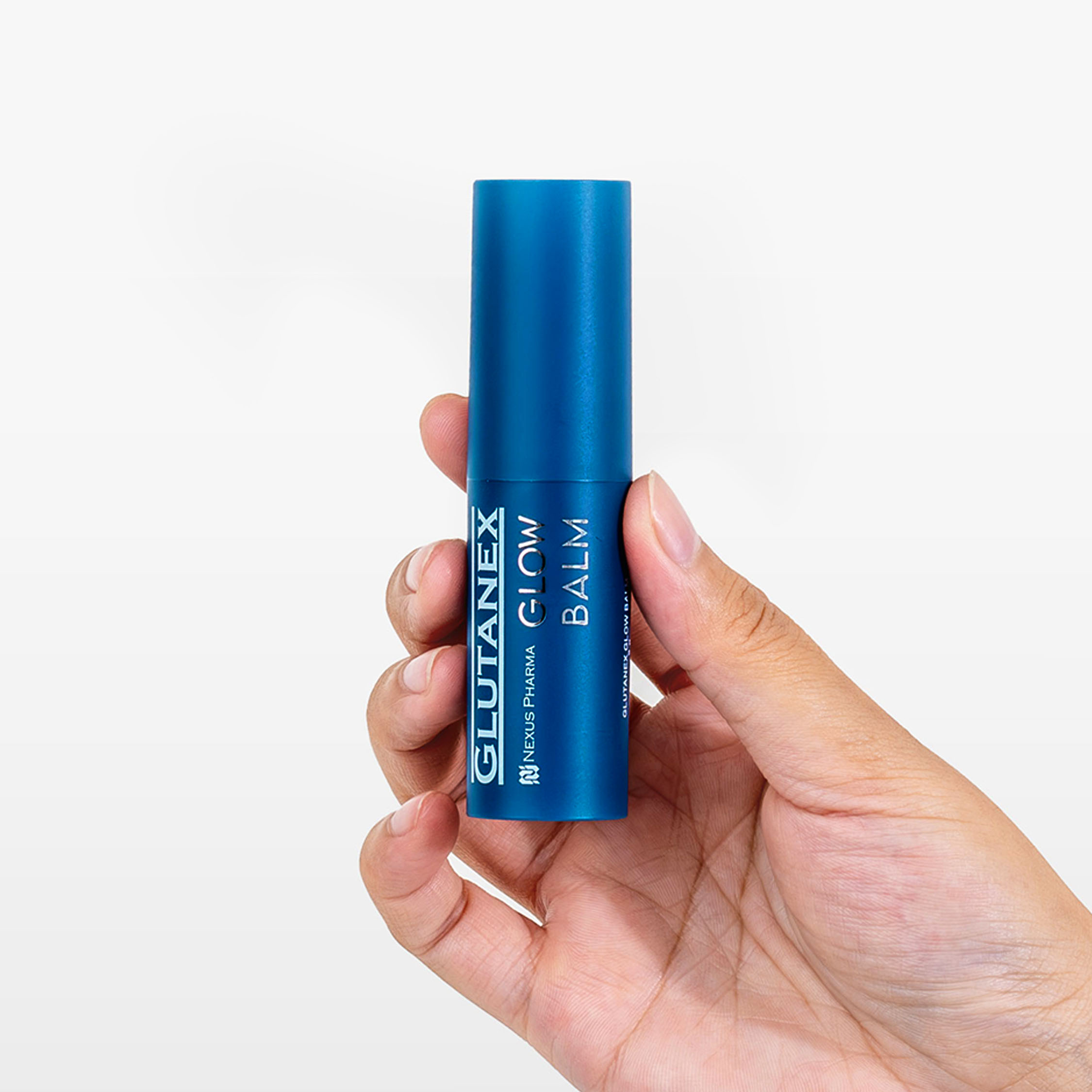 Close-up shot of a hand holding Nexus Pharma's Glutanex Glow Balm, a key to instant radiance and long-lasting skin health