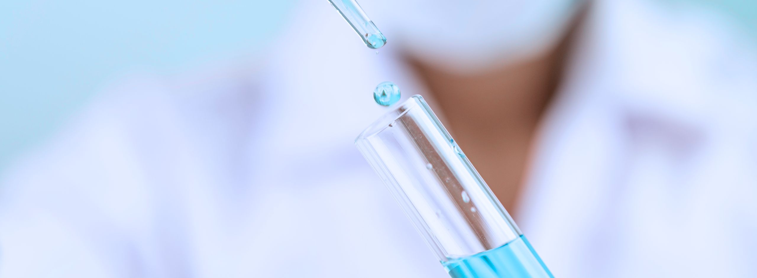 Scientist mixing formulas in a lab, exploring the science behind pharmaceutical vs. natural skincare.