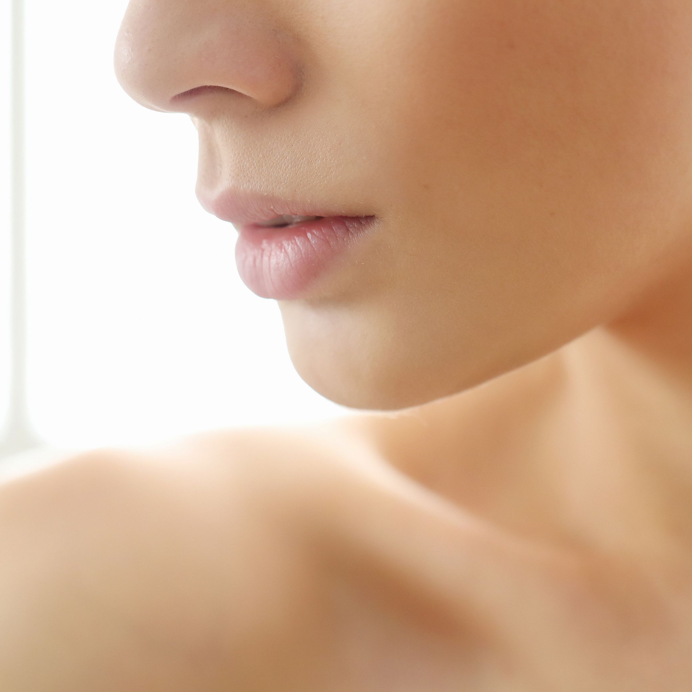 Close-up of Woman Examining Healthy Skin