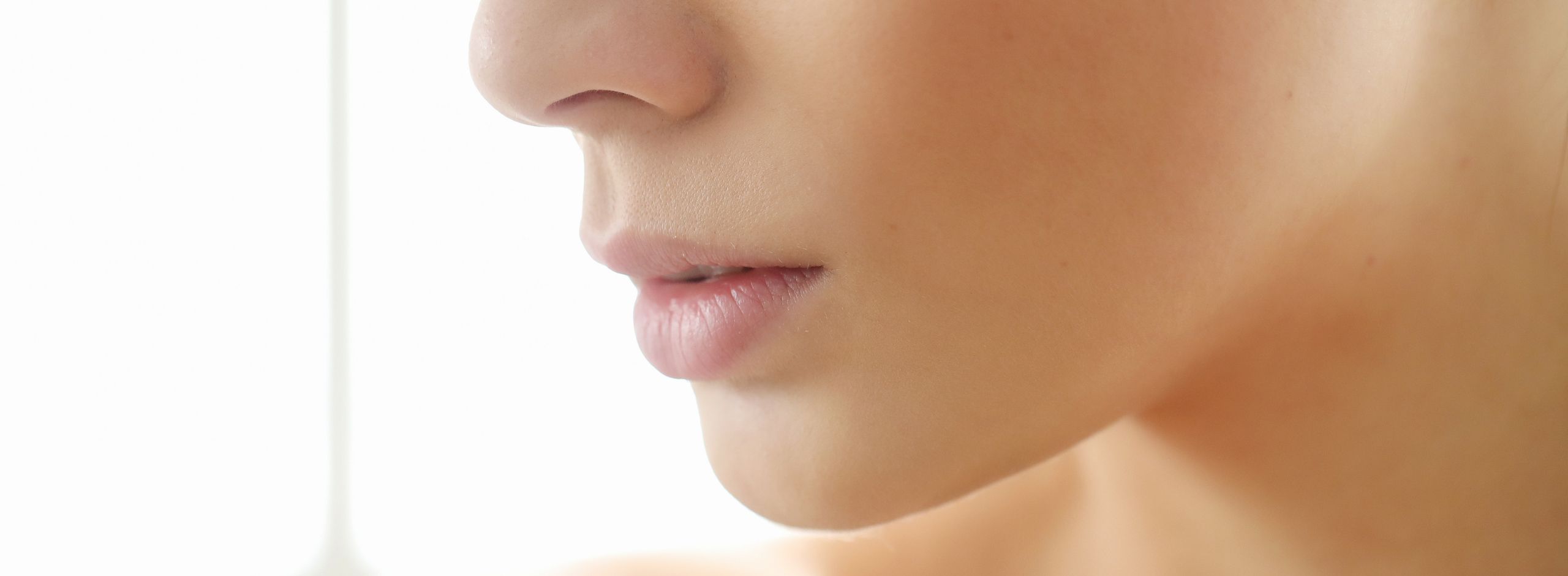 Close-up of Woman Examining Healthy Skin
